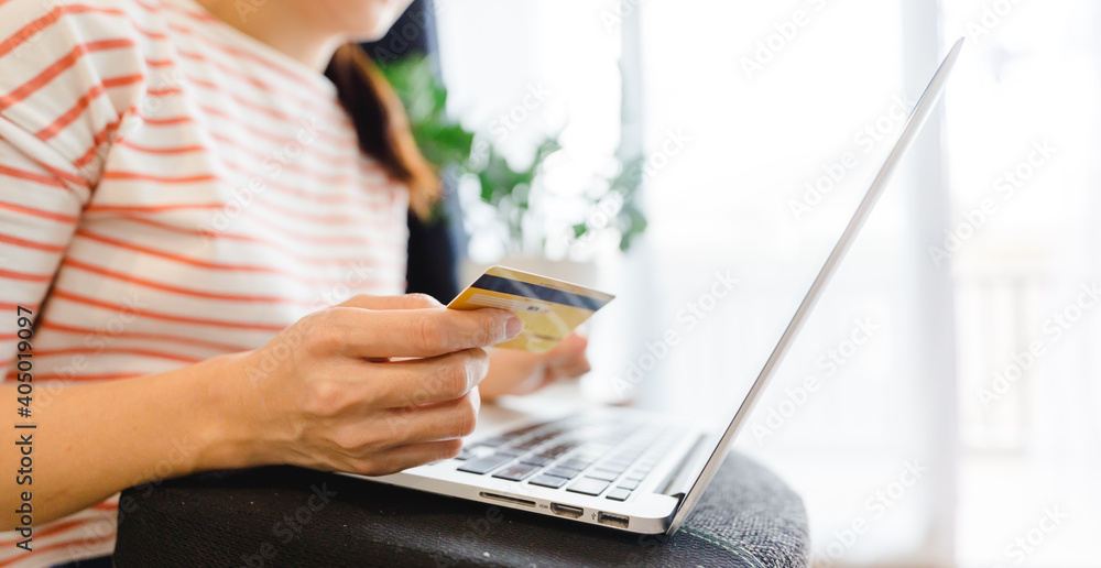 Online shopping with credit card.Woman hands holding credit card for register online store.Dark store shopping.transfer money, Bank, Finance, Digital paying, Payment, Commercial, Services, Delivery.