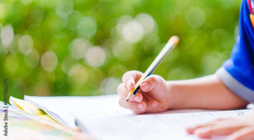 Φωτογραφία Toddler boy student online learning class study online video call zoom holding pencil writing english alphabet online with laptop at home