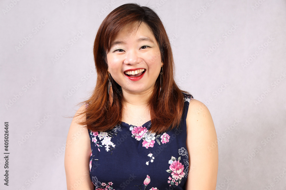 Young attractive southeast Asian woman posing facial expression happy joyful funny Young attractive southeast Asian woman posing facial expression happy joyful funny