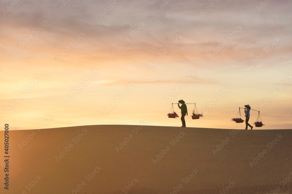 Asian woman Vietnam culture traditional dress on sandune during sunset ,traditional costume ,Muine Vietnam Asian woman Vietnam culture traditional dress on sandune during sunset ,traditional costume ,Muine Vietnam