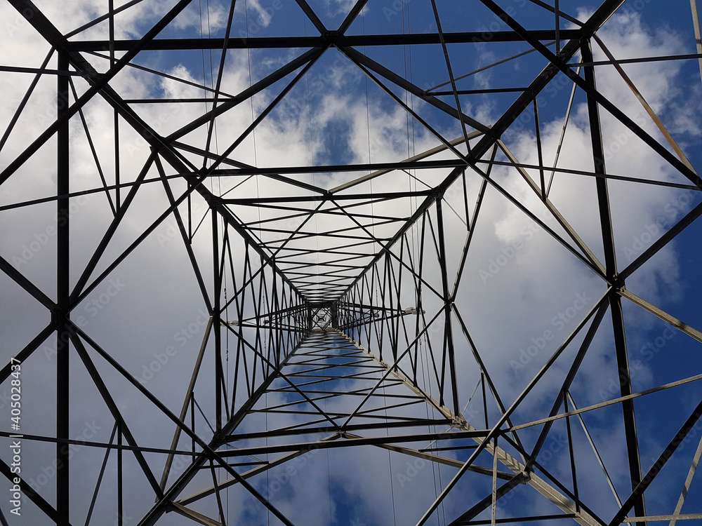 electricity pylons down to the top view cords blue sky clouds background electricity pylons down to the top view cords blue sky clouds background