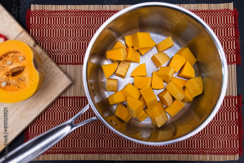 pumpkin cubes in bottom of stainless steel pot