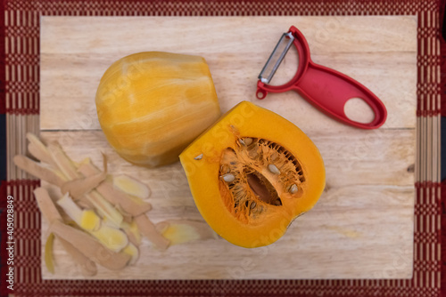 peeled butternut squash on a board
