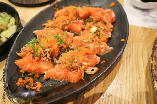 Spicy Salmon on black plate