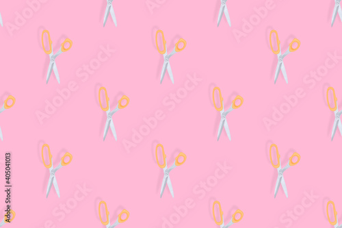 Scissors seamless pattern. Hairdressing scissors against pink background backdrop.