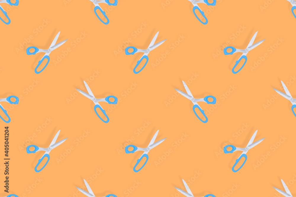 Fototapeta premium Scissors seamless pattern. Barber scissors against orange background backdrop.