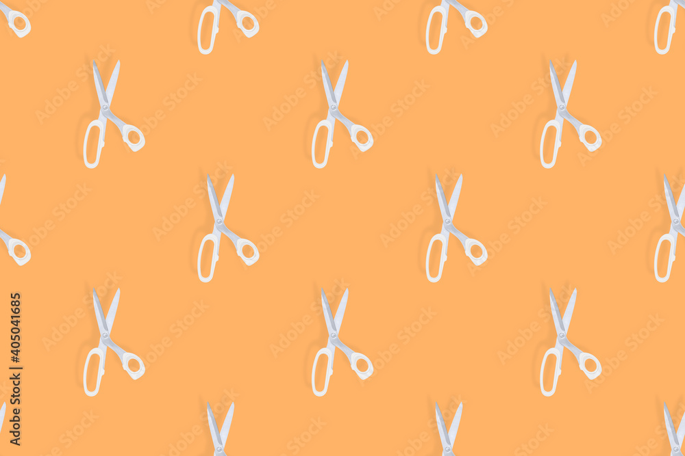 Scissors seamless pattern. Barber scissors against orange background backdrop.