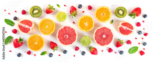 Fresh fruit panorama. Citrus fruits with blueberries and mint, overhead flat lay shot on a white background