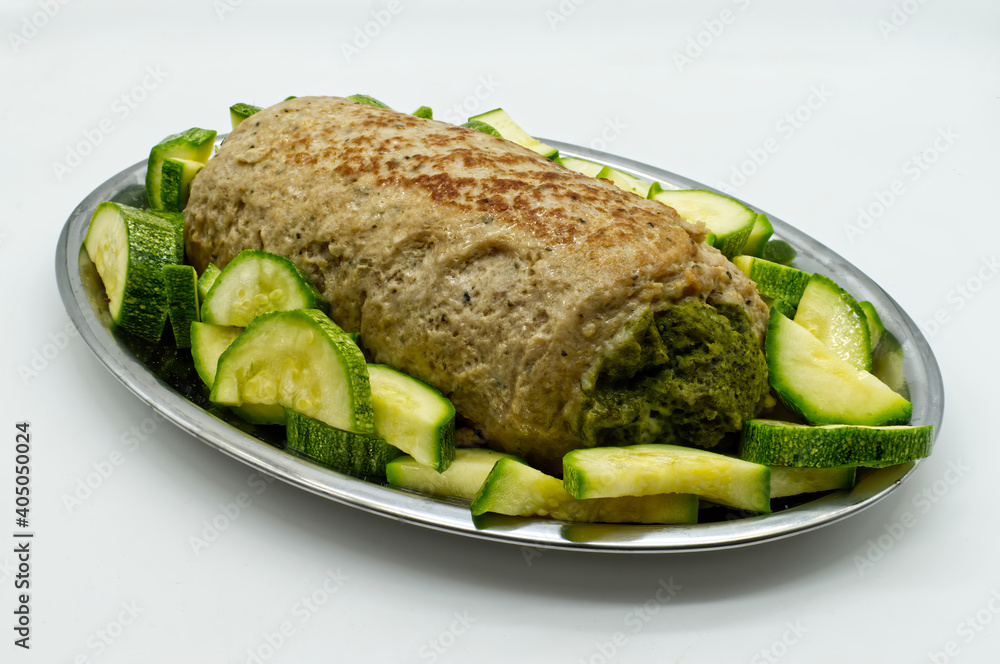 Spinach meatloaf with zucchini isolated on white background. Spinach meatloaf with zucchini isolated on white background.