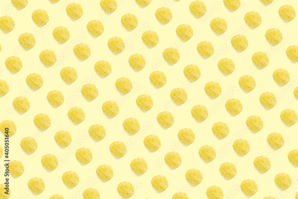 background made from Potato chips on light yellow background flat lay. potato snack chips isolated Fast food banner.