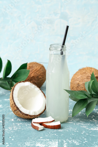 Bottle of fresh coconut water on table