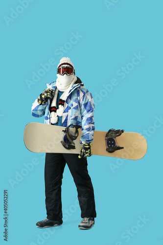 Male snowboarder on color b...
