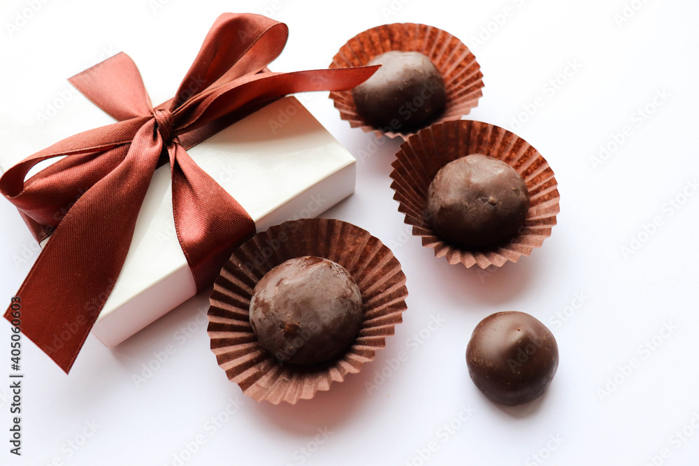 Beautiful gift boxes and chocolates isolated on a white background. Beautiful gift boxes and chocolates isolated on a white background.