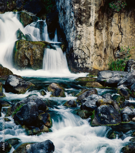 Water flowing over rocks and down river at Tarawera Falls photo