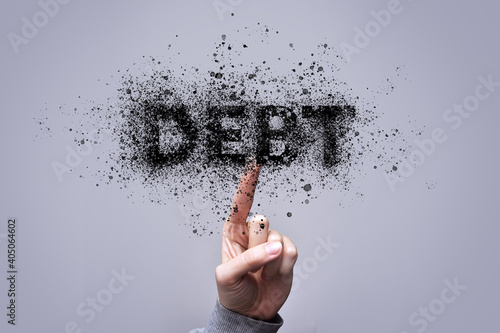Quadro su tela man dispels the word Debt. Debt reduction