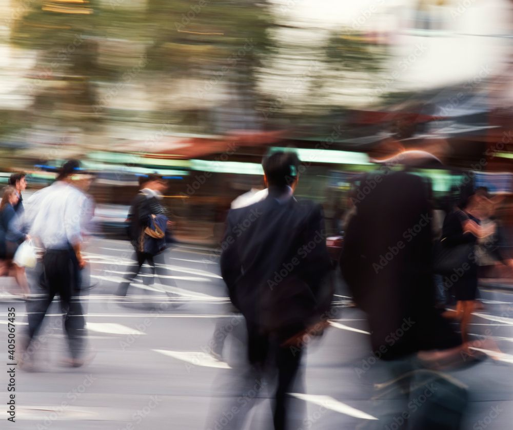 People crossing intersection in city People crossing intersection in city