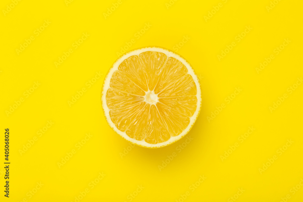 Lemon slice on a yellow minimal background. Bright juicy lemon on a yellow blank isolated background. Summer, sun, health concept. Lemon slice on a yellow minimal background. Bright juicy lemon on a yellow blank isolated background. Summer, sun, health concept.