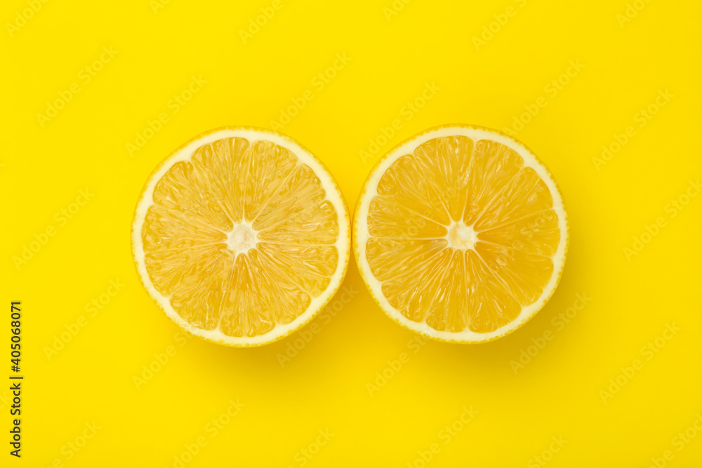Lemon slices on a yellow minimal background. Bright juicy lemon on a yellow blank isolated background. Summer, sun, health concept. Lemon slices on a yellow minimal background. Bright juicy lemon on a yellow blank isolated background. Summer, sun, health concept.