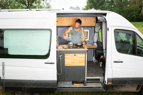 Fotobehang Man living in a DIY camper van