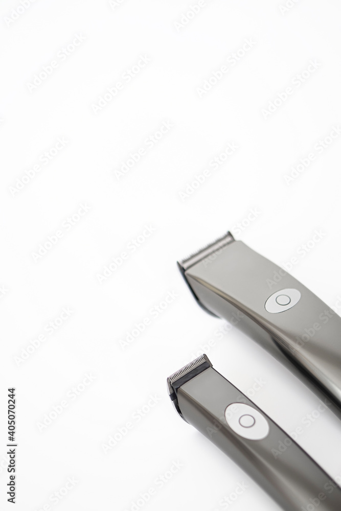 Two silver Hair clipper - barber machine isolated on white . Two silver Hair clipper - barber machine isolated on white .