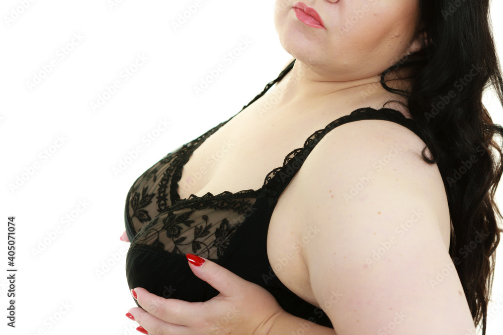 Woman in black bra showing her breast chest.
