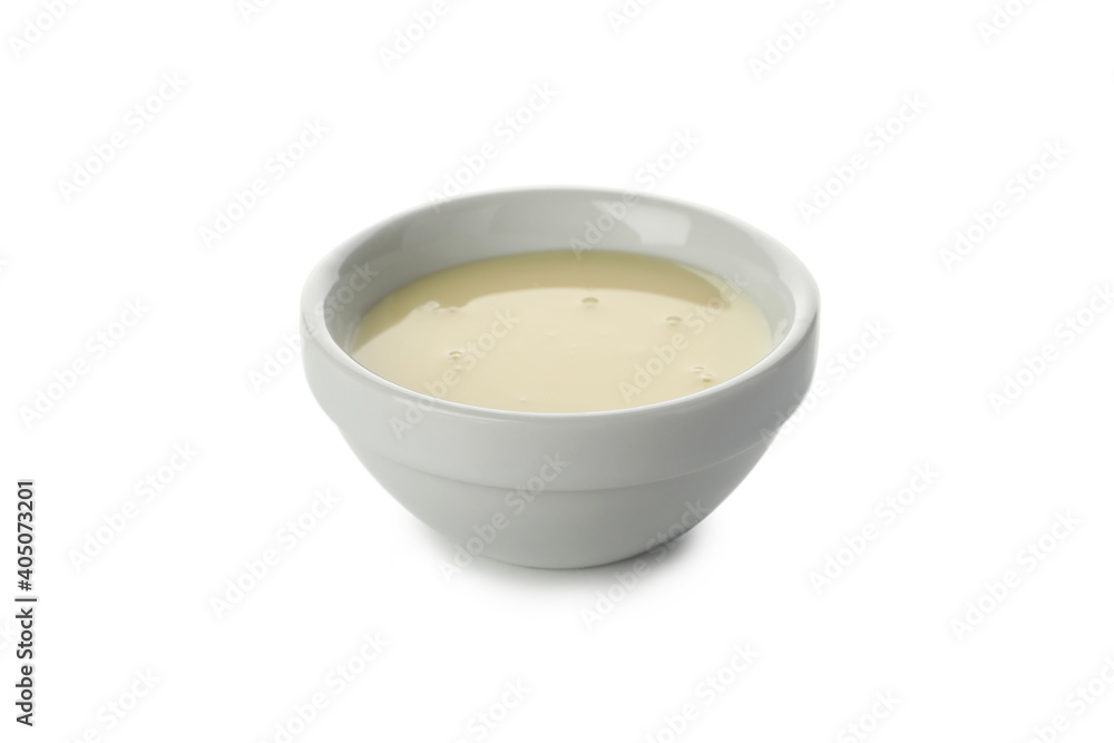 Bowl with condensed milk isolated on white background Bowl with condensed milk isolated on white background