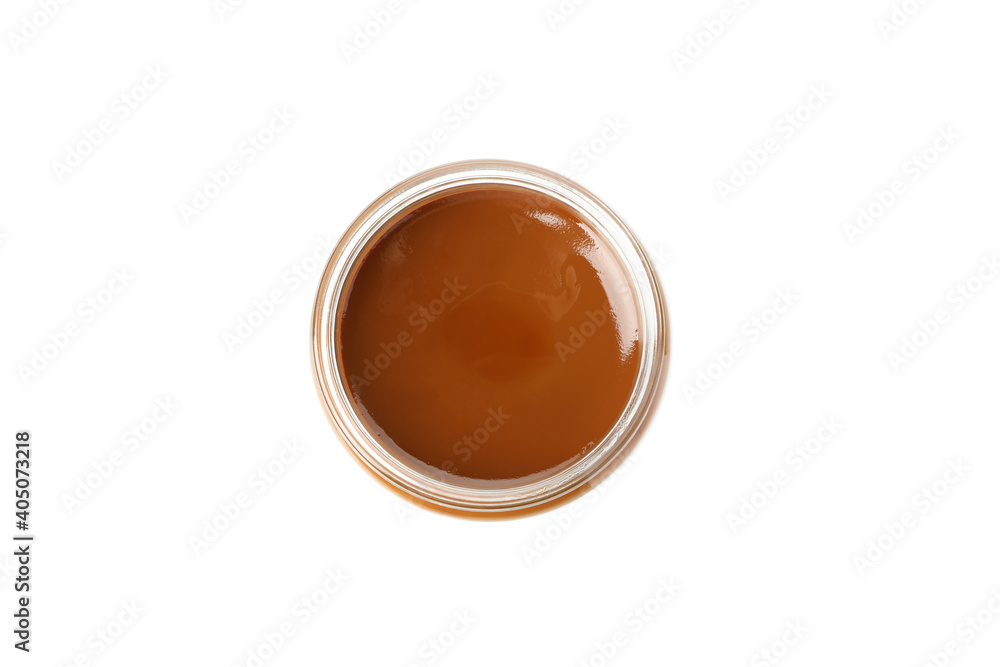 Glass jar with caramel condensed milk isolated on white background Glass jar with caramel condensed milk isolated on white background