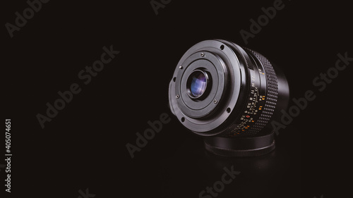 Old M42 mount vintage lens.
Good quality, versatile and easy to adapt almost any of these modern days mirrorless camera systems with a single adapter.