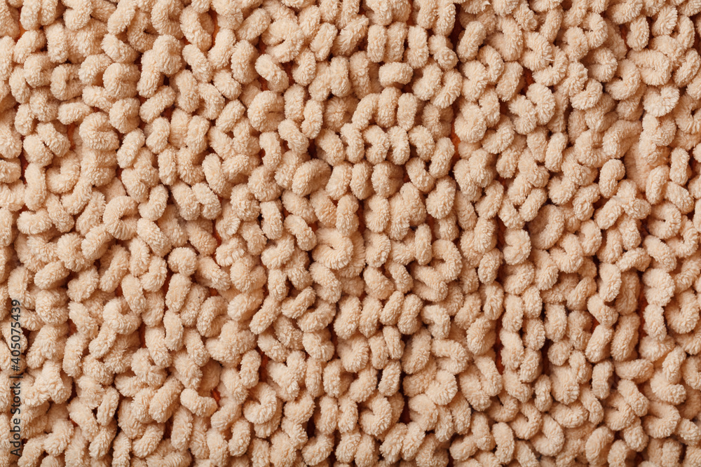 Full screen brown wool loop texture as background. Full screen brown wool loop texture as background.