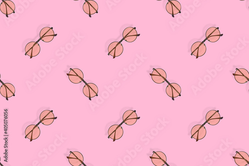 Glasses seamless pattern. Glasses for improving vision on a pink background.