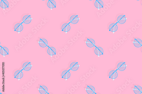 Glasses seamless pattern. Glasses for improving vision on a pink background.