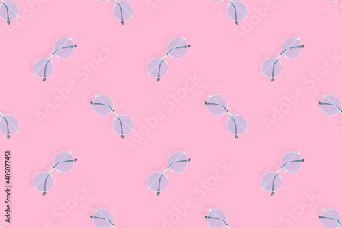 Glasses seamless pattern. Glasses for improving vision on a pink background.