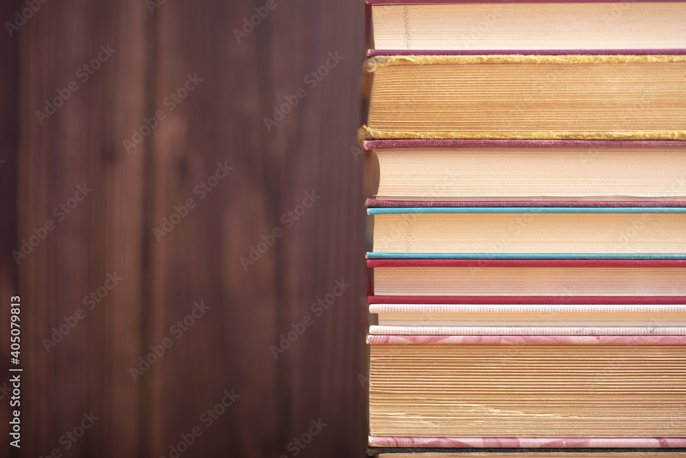 Pile of old books on the table. Wisdom of world hidden in the book. Learning. Education. Pile of old books on the table. Wisdom of world hidden in the book. Learning. Education.