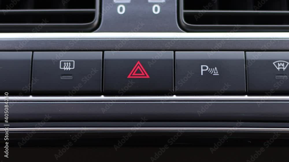 Emergency button flashes on the car dashboard. Emergency button flashes on the car dashboard.