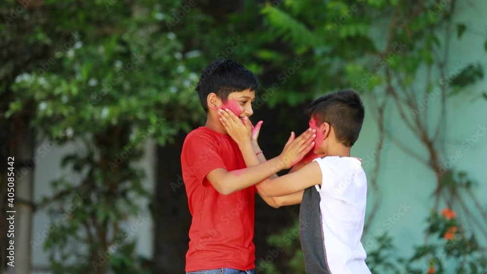 Holi festival : Indian child playing Holi in India. Holi is colors festival Holi festival : Indian child playing Holi in India. Holi is colors festival