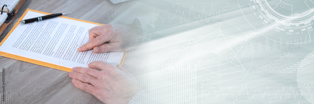 Businessman checking a document; panoramic banner Businessman checking a document; panoramic banner