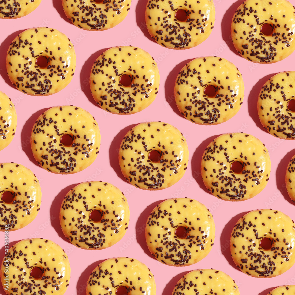 paterna of mouthwatery fresh doughnuts on a pink background paterna of mouthwatery fresh doughnuts on a pink background