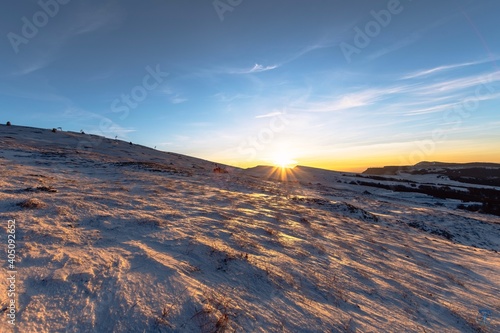Fotografie, Obraz Scenic View Of Snowcapped Mountains Against Sky During Sunset