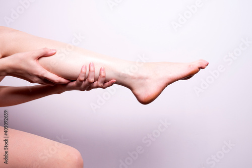 massage of leg muscles with hands  leg pain