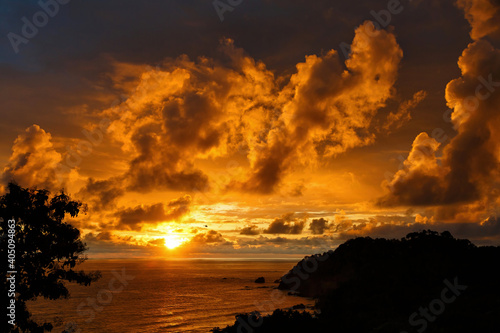 Tropical sunset at the coastline of the Pacific Ocean in Manuel Antonio in Costa Rica