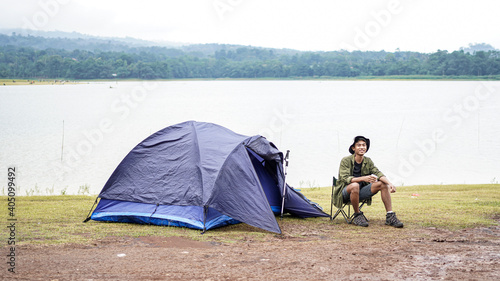 traveller man drink coffee at camp