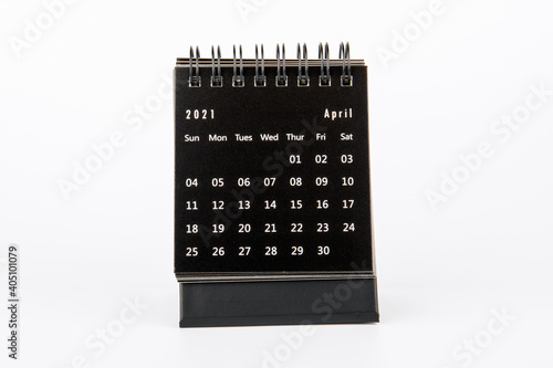 2021 April. Time planning, business, day counting and holidays. Paper calendar on a white table