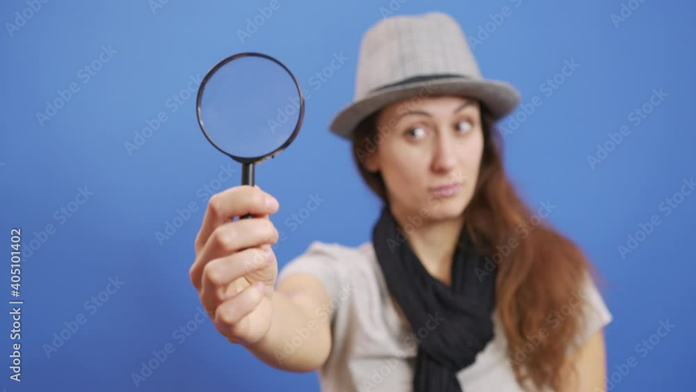 Funny girl looking throw Magnifier to the Camera . Trendy red-haired Woman having fun. Colorful Portrait. Beautiful Girl. Funny Frame. Amazing Eyes. Funny girl looking throw Magnifier to the Camera . Trendy red-haired Woman having fun. Colorful Portrait. Beautiful Girl. Funny Frame. Amazing Eyes.