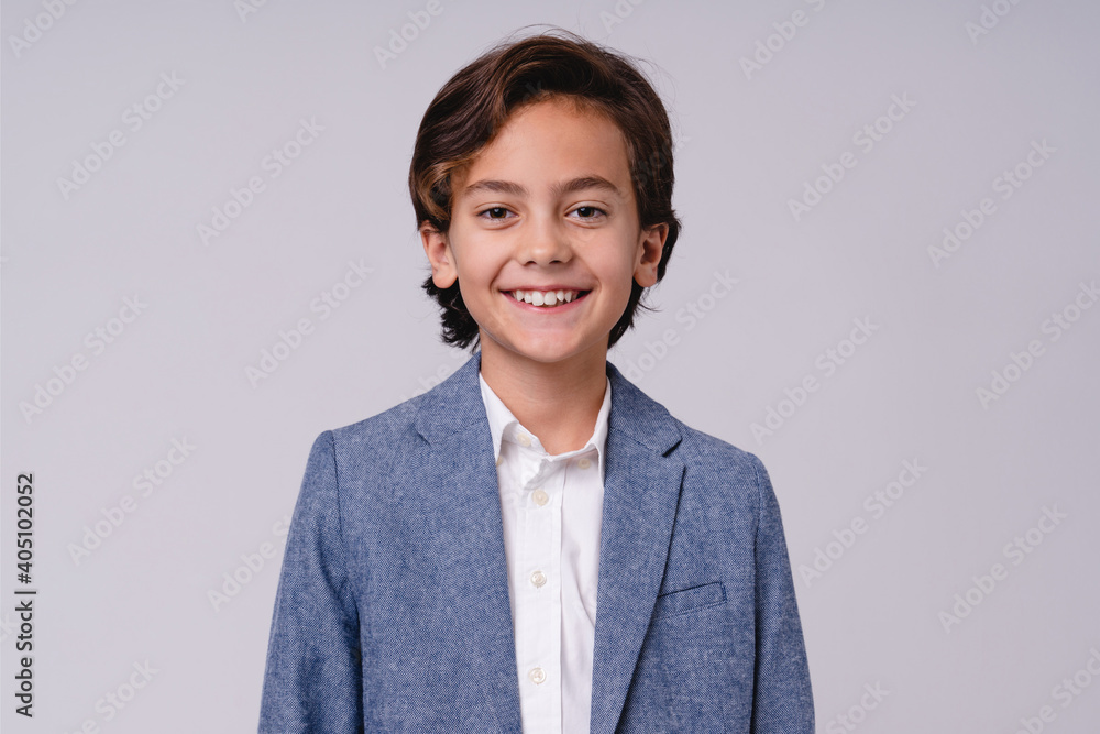 Smiling confident future businessman in formal outfit isolated over white background Smiling confident future businessman in formal outfit isolated over white background