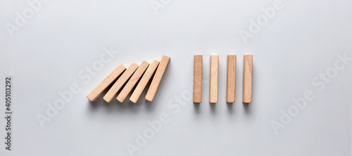 Domino effect against gray background