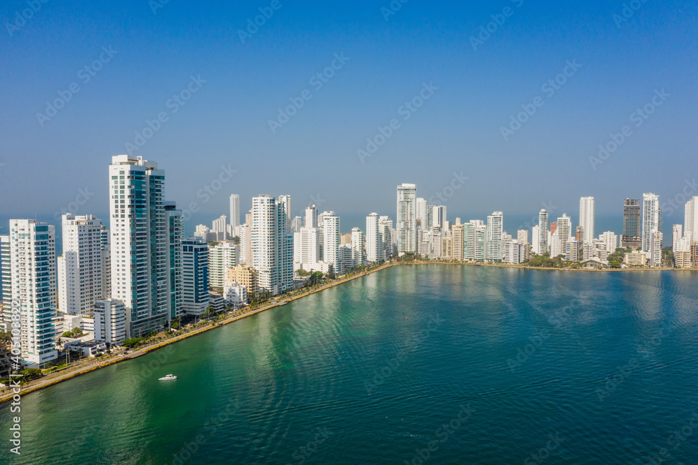 Skyscraper with white facades at a bright sunny day on the blue sky background. Economy finances and business activity concept aerial view