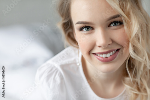 Portrait of a happy young woman at home