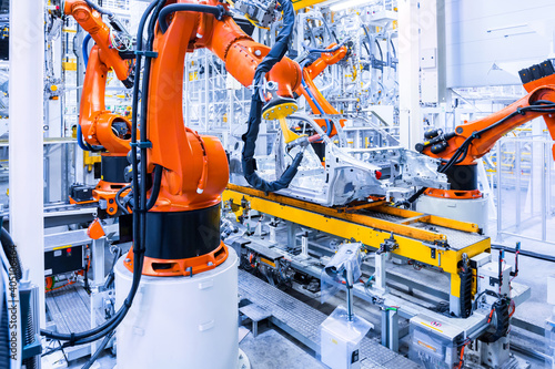 Obraz na płótnie robots in a car factory w salonie