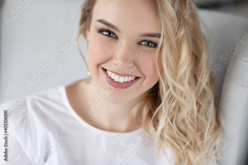 Portrait of a happy young woman at home