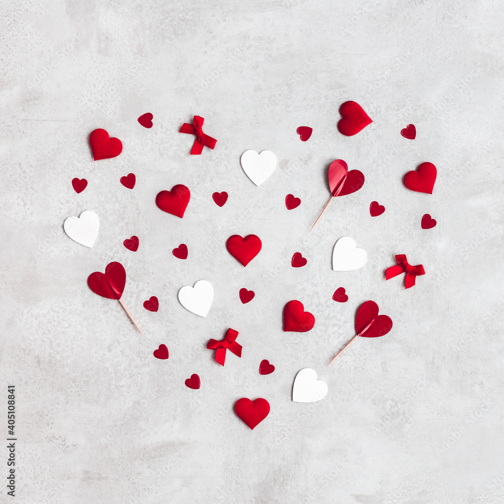Valentine's Day background. Red and white hearts on concrete gray background. Valentines day concept. Flat lay, top view